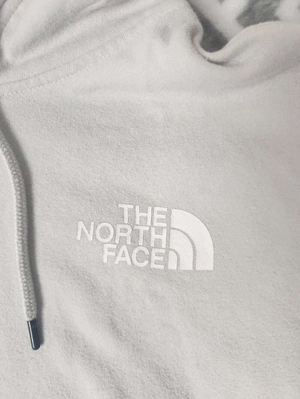 The North Face Never Stop Exploring Cream Hoodie with Blue & Purple Graphic
